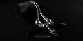 Black Onyx Elegance Necklace by Bizareart featuring three pointed onyx stone spikes and detailed sterling silver loops on a black display pillow.