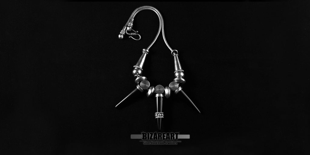 Handcrafted sterling silver necklace showing the secure gothic-style hook-to-loop clasp and snake chain layout.