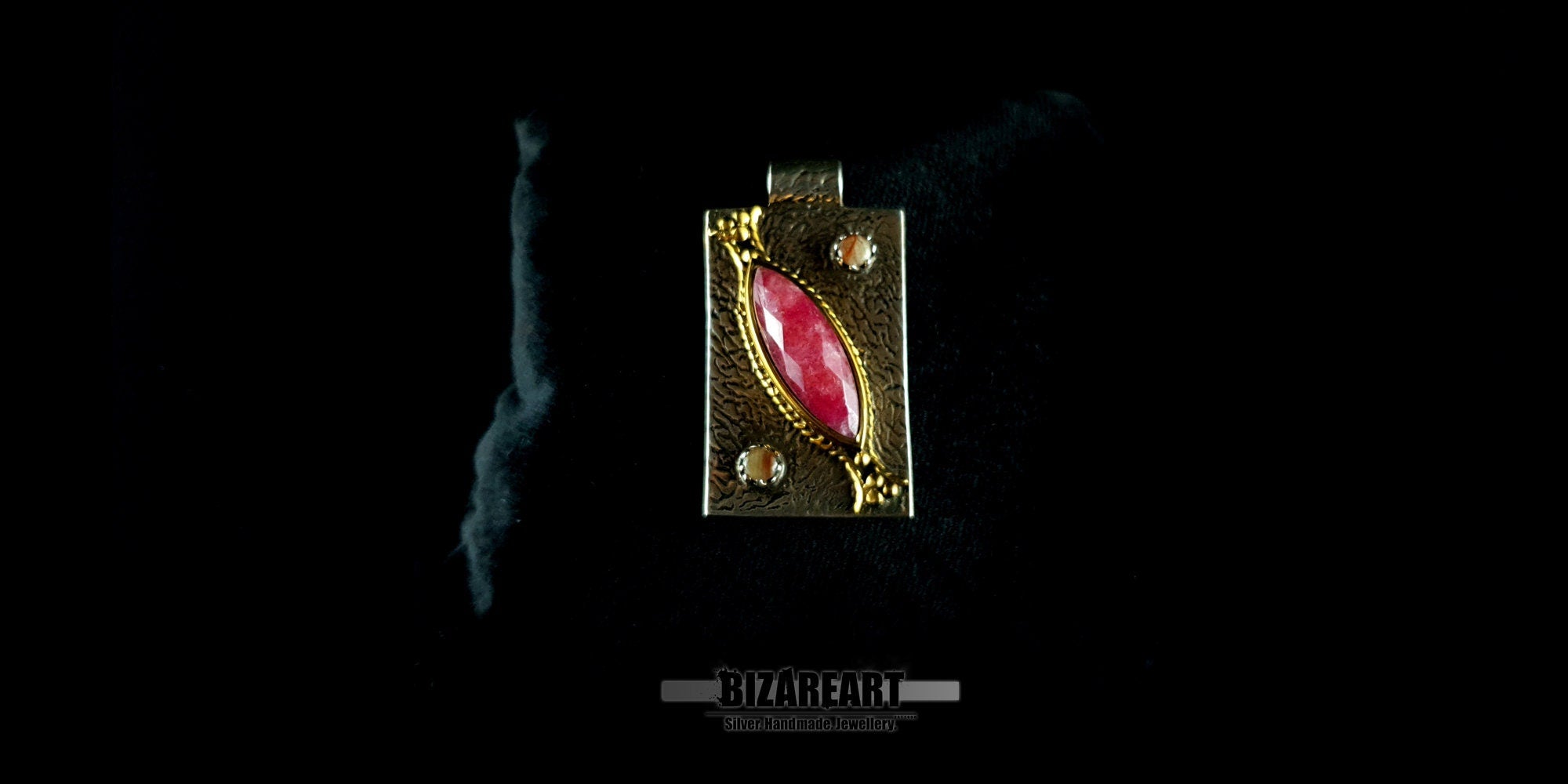 Front view of the 5-part handmade silver and pink ruby artisan pendant by BIZAREART.