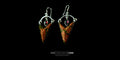 Front-facing view of a pair of Sterling Silver Trillion Unakite earrings featuring large triangular green and pink gemstones with small teardrop garnet accents, set against a black background.