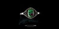 Ruby Zoisite and garnet sterling silver statement bracelet displayed on a black jewelry pillow.