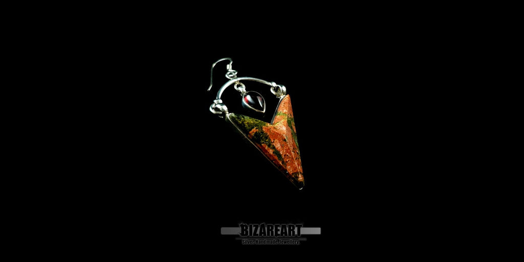 Close-up of a single Silver Trillion Unakite earring showcasing the intricate silver craftsmanship, the vibrant green hues of the stone, and the secure French hook ear wire.