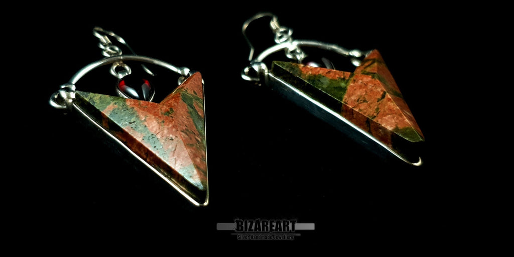 Angled side view of the Unakite and Garnet earrings, highlighting the depth of the silver bezel setting and the natural mossy textures of the trillion-cut gemstones.