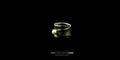 Side view of a handmade Bizareart wrap ring in oxidized sterling silver with a raw, sculptural texture and a single white freshwater pearl set against a black background.