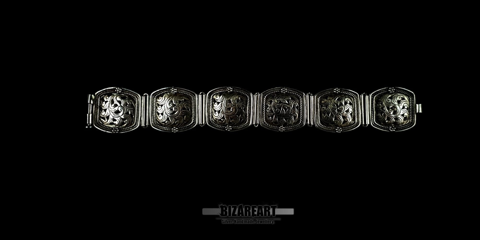 An overhead view of the six individual hand-engraved silver panels linked together to show the full floral pattern layout.