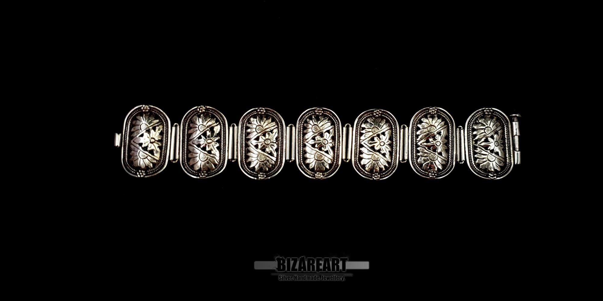 Full length view of the 19cm sterling silver bracelet laid completely flat, showcasing all seven individual panels.