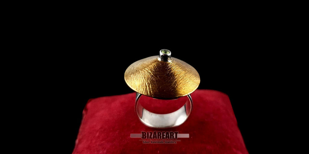 Close-up profile of the ring showcasing the intricate "scratched" texture of the gold plating.