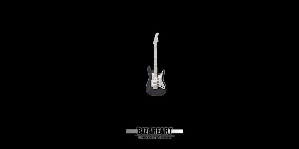 Front view of a detailed 925 sterling silver electric guitar pendant against a solid black background, showcasing the intricate white pickguard and layered metal design.