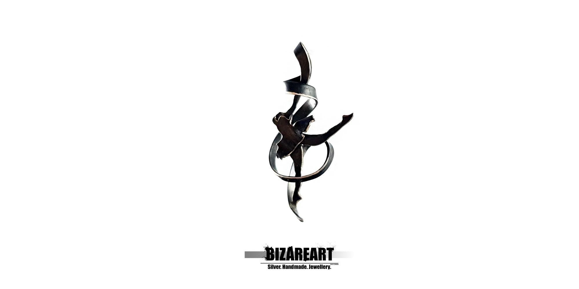 A high-contrast studio shot of the black oxidized silver pendant against a white background, emphasizing its silhouette and fluid lines.