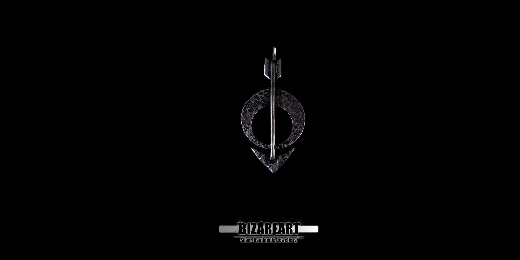 Distant view of the silver moon arrow charm, highlighting its sleek, lightweight silhouette.