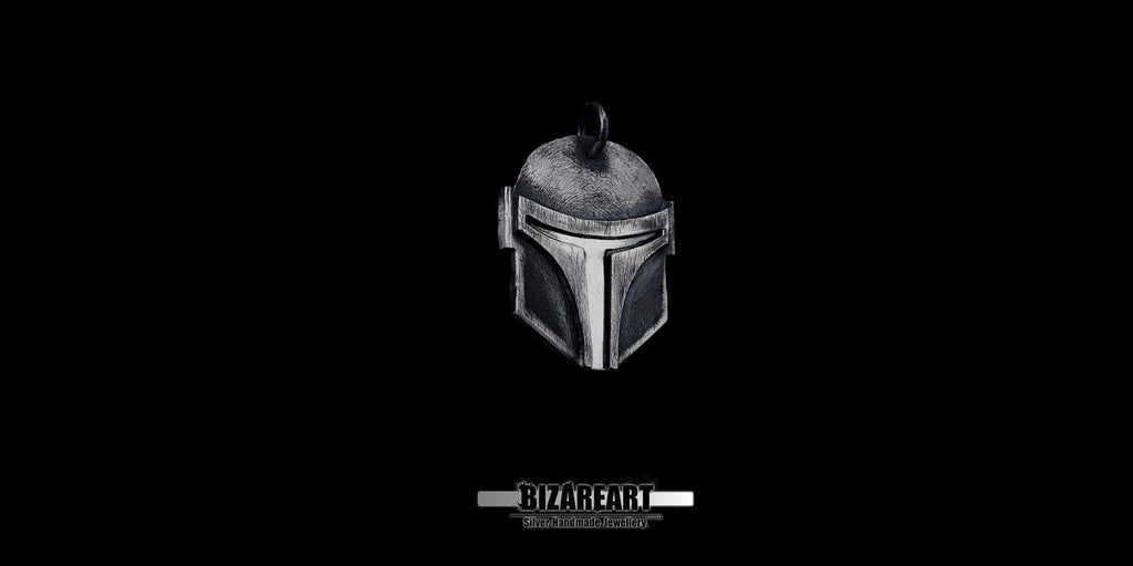 Handcrafted 925 sterling silver Boba Fett helmet pendant with a dark oxidized finish, displayed on a solid black background.