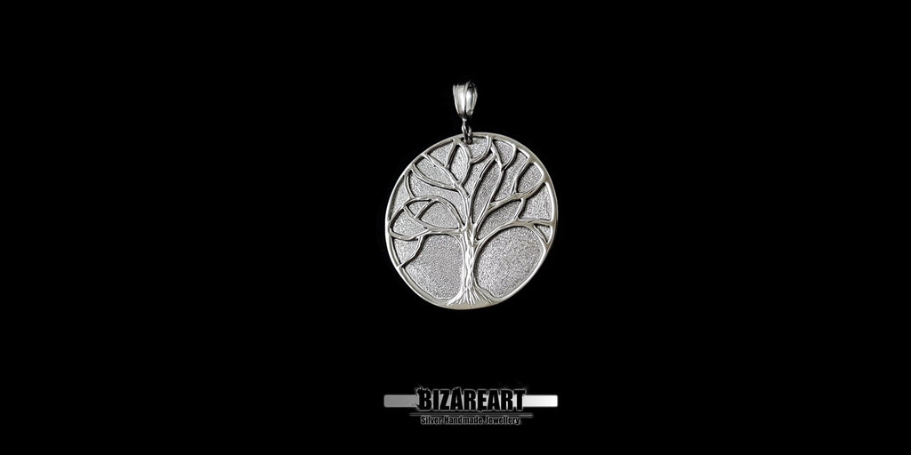 Side view of the Oxidized sterling silver Tree of Life pendant with high-contrast carved details