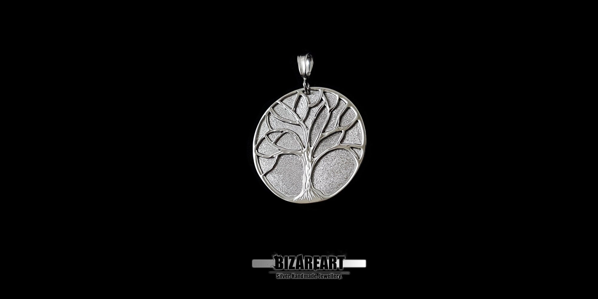 Side view of the Oxidized sterling silver Tree of Life pendant with high-contrast carved details