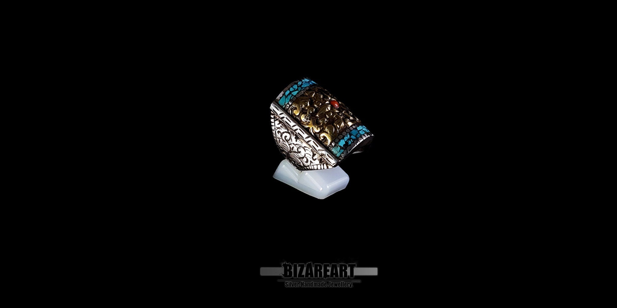 Detailed side view of a vintage Himalayan artisan ring, showcasing the intricate hand-engraving on the flat-edged silver band.