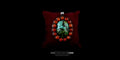 Handmade sterling silver bohemian pendant featuring a large oval green-blue Himalayan turquoise stone surrounded by a halo of round red coral beads, displayed on a dark red velvet pillow.
