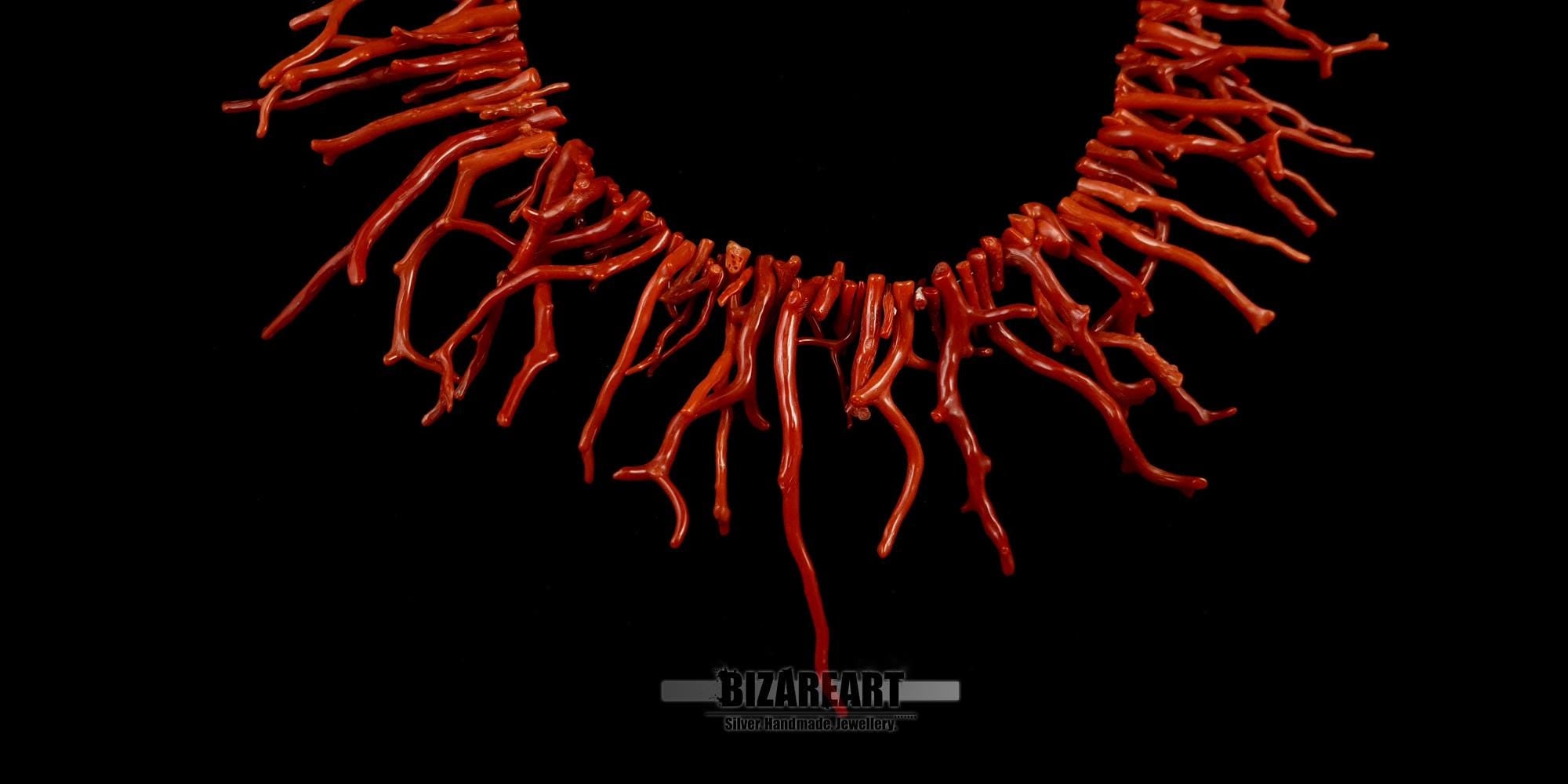 A close-up of the handcrafted 925 sterling silver tongue clasp, featuring a central coral inlay that blends seamlessly with the necklace design.
