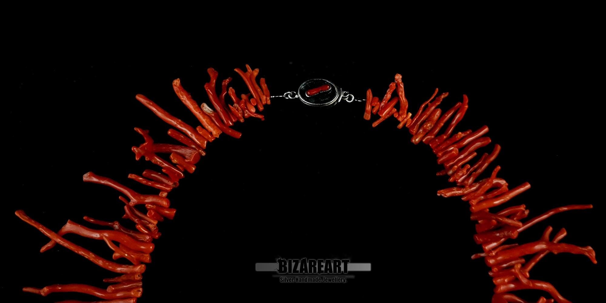 Close-up of the custom 925 sterling silver clasp featuring a genuine red coral inlay on a branch necklace.