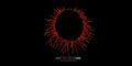 A striking Mediterranean Red Coral necklace displayed against a solid black background. The coral branches radiate outward in a circular pattern, creating a bold, organic fringe.