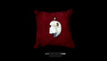 A profile-style sterling silver portrait pendant of a woman, featuring a gold-plated eye detail, resting on a plush dark red velvet cushion against a black background.