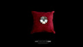 A handmade 925 sterling silver flower pendant with carved petals, displayed on a small red velvet cushion against a solid black background.
