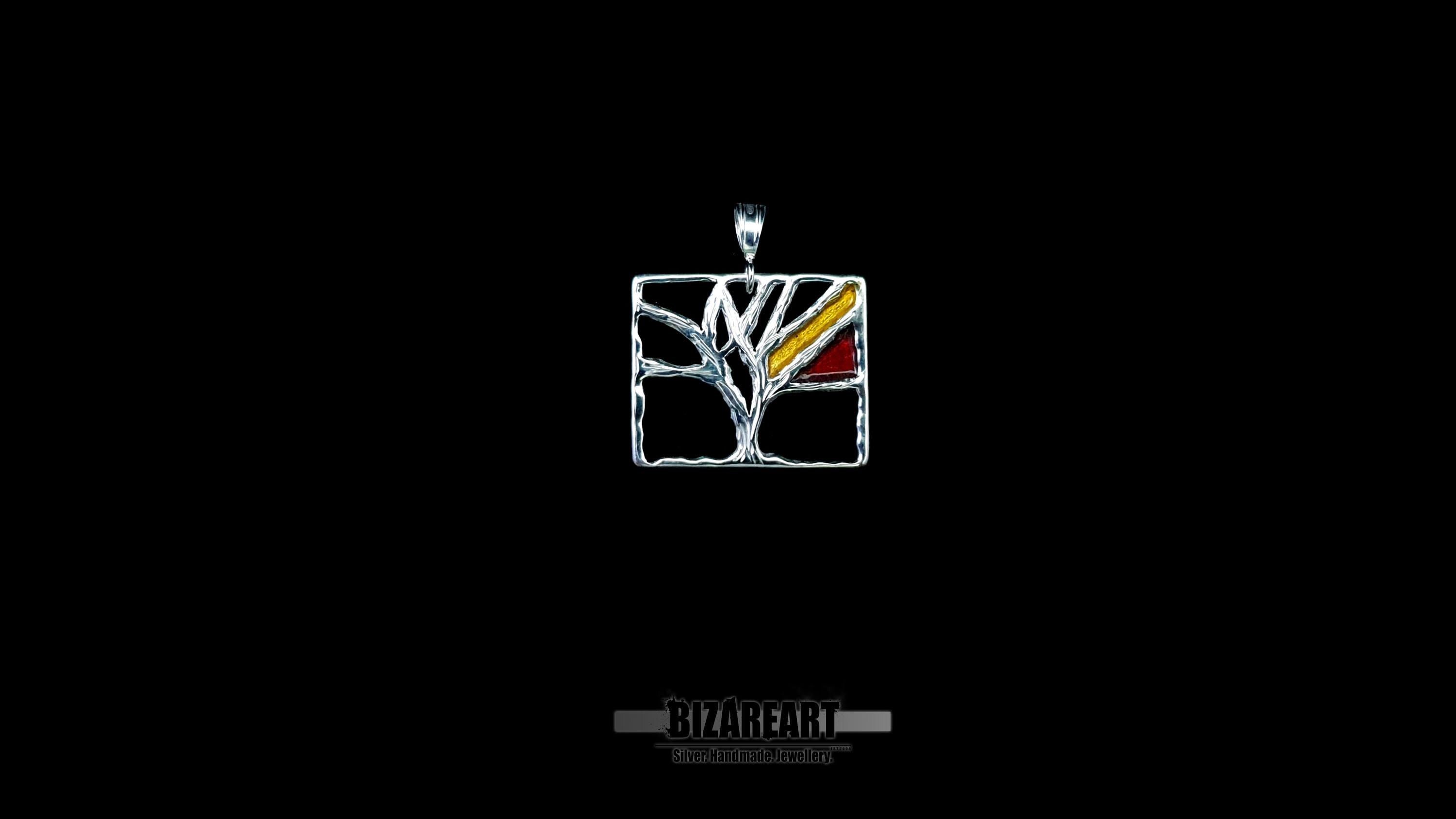 Black background of Sterling silver Tree of Life necklace in a geometric Mondrian-inspired style
