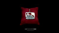 Handcrafted sterling silver bear and forest diorama pendant resting on a luxury crimson red velvet display pillow against a black background.
