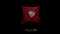 Hand-forged sterling silver heart melody pendant resting on a luxurious deep red velvet pillow, centered against a dramatic black background with a clean brand watermark below.