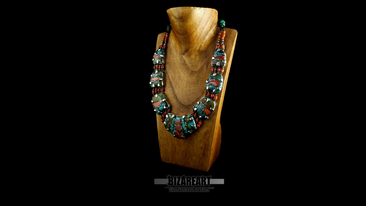 Side perspective of 7 plate silver turquoise collar necklace on wooden display