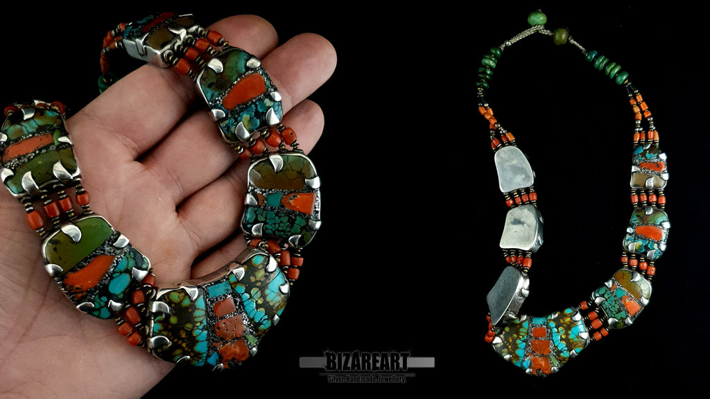 Hand holding heavy 178g turquoise silver collar necklace displaying scale and texture