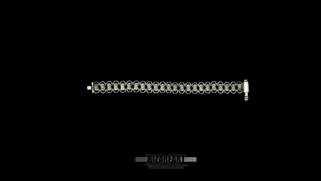 Full-length flat lay view of the Byzantium textured sterling silver link bracelet against a solid black background, showcasing the repeating link pattern.
