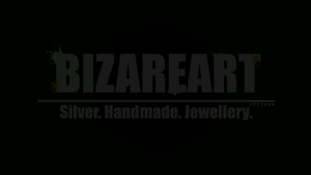 60-degree rotating product video showcasing the texture, density, and light reflection of the artisan ruby link bracelet.